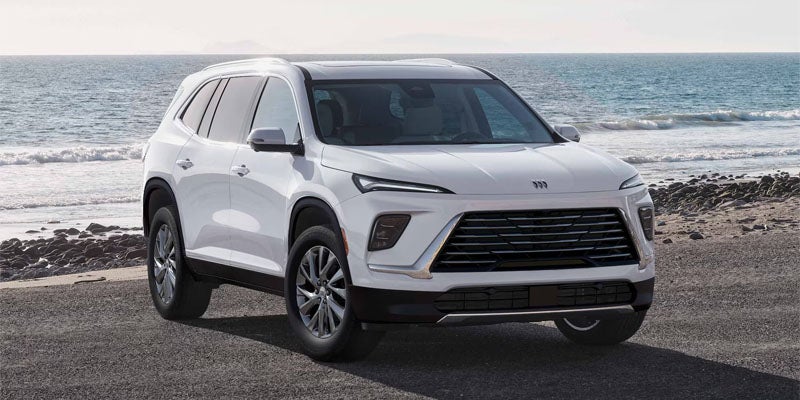 2026 Buick Enclave front view stand outside of the sea.